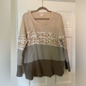 Women’s pink lily size medium casual printed sweater.